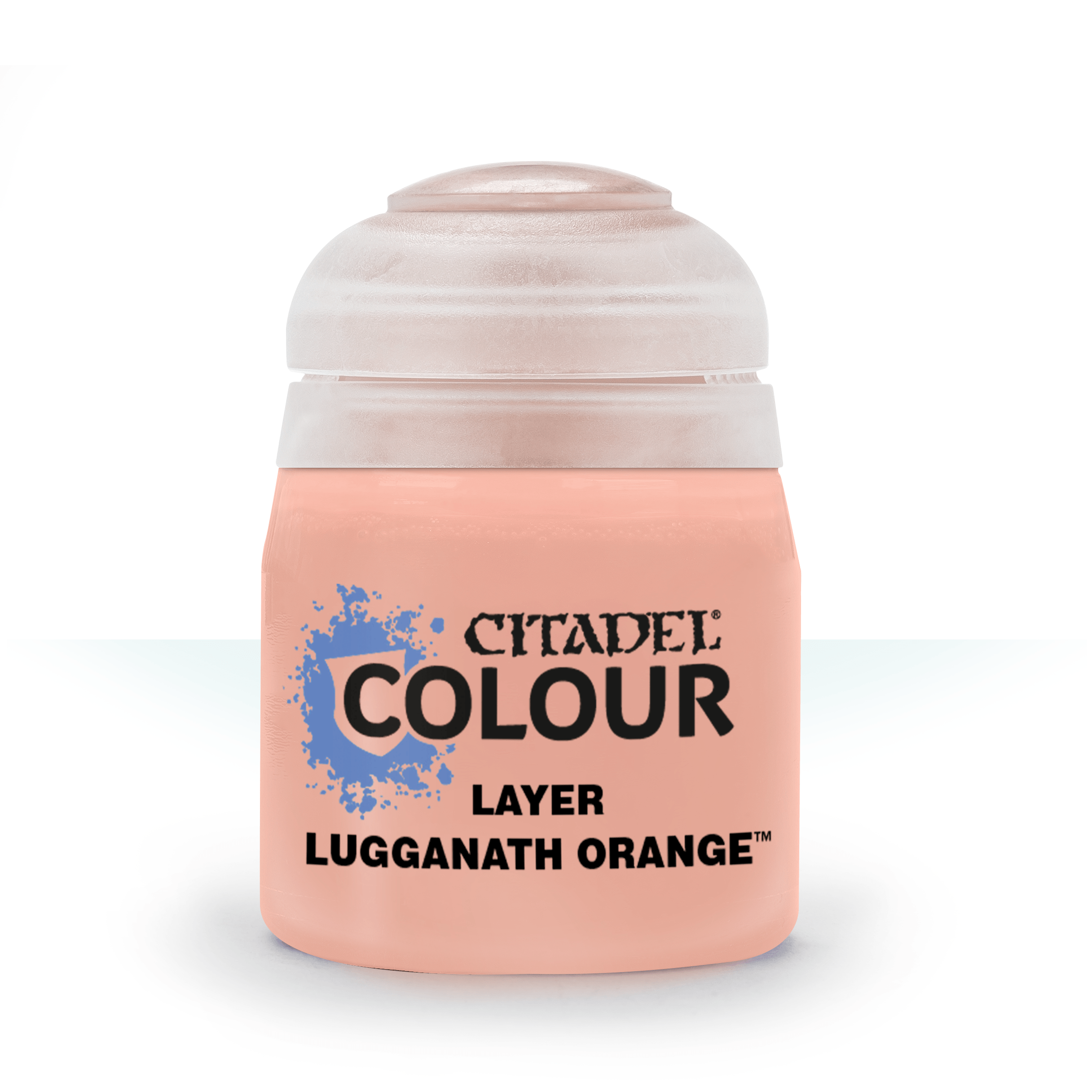 a bottle of orange colored paint on a white background
