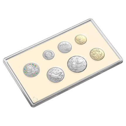 a silver and gold coin set on a white background