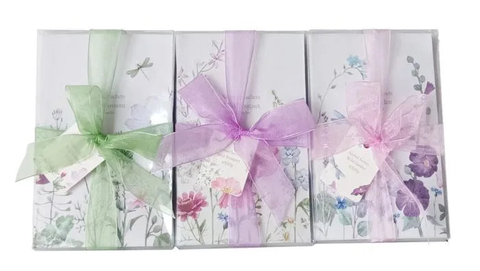 a set of four cards with ribbons and bows