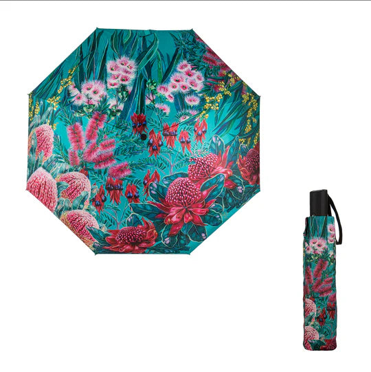 an umbrella with a floral pattern and a black handle