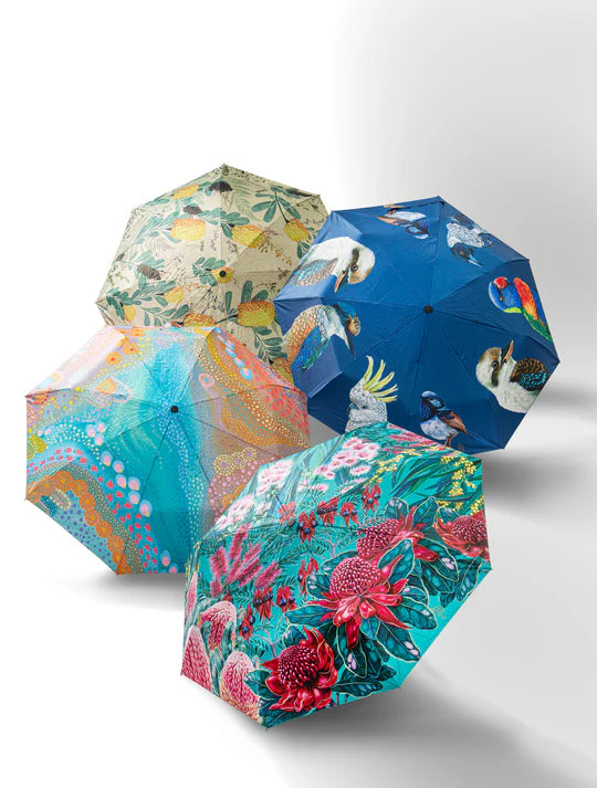a group of three umbrellas sitting next to each other