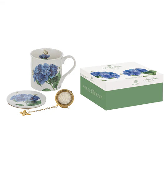 a blue rose coffee cup and saucer with a box