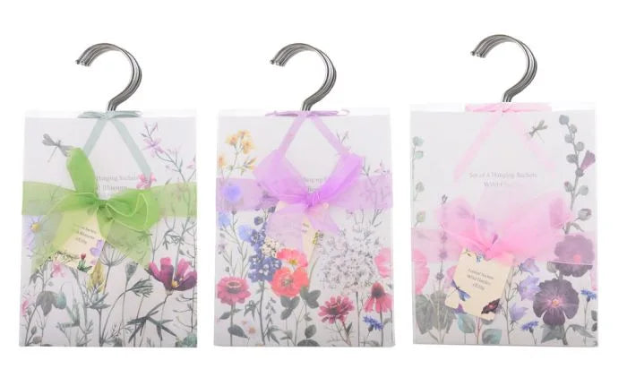 three small bags with bows on them