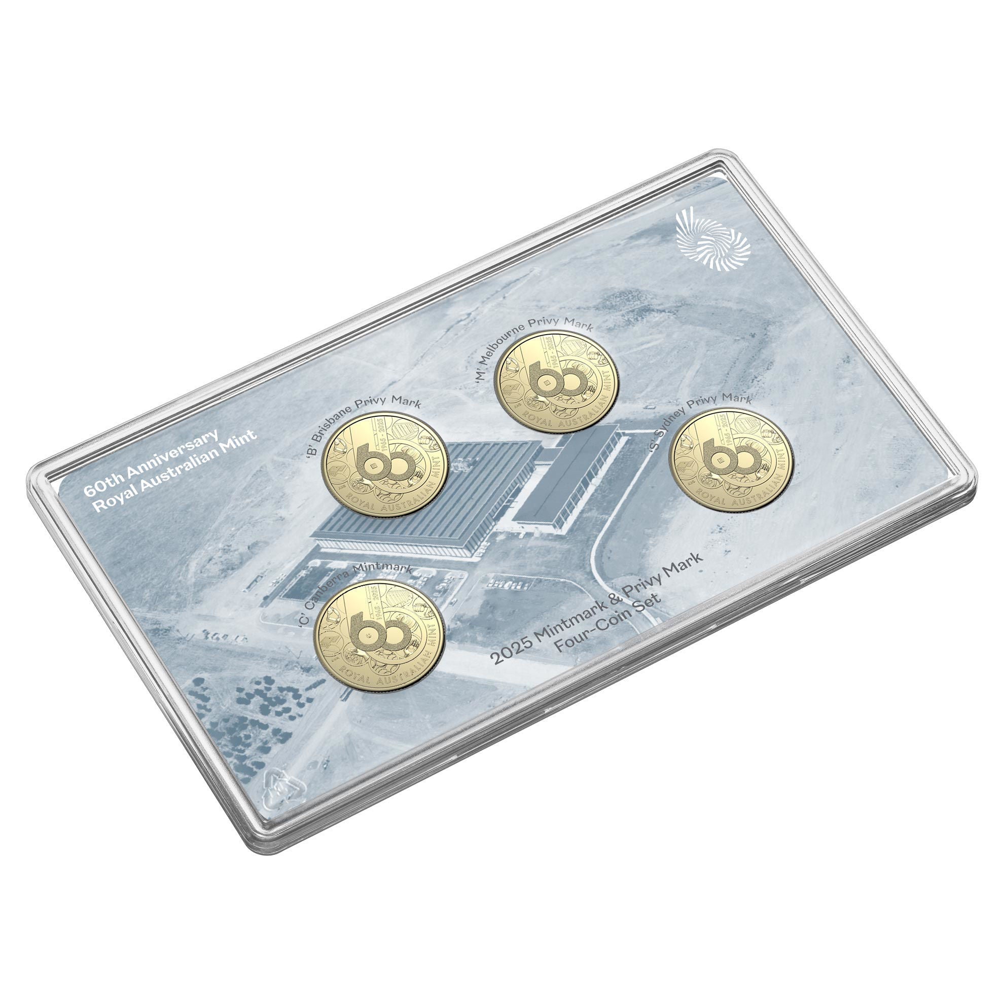 a set of three gold coins sitting on top of a metal tray