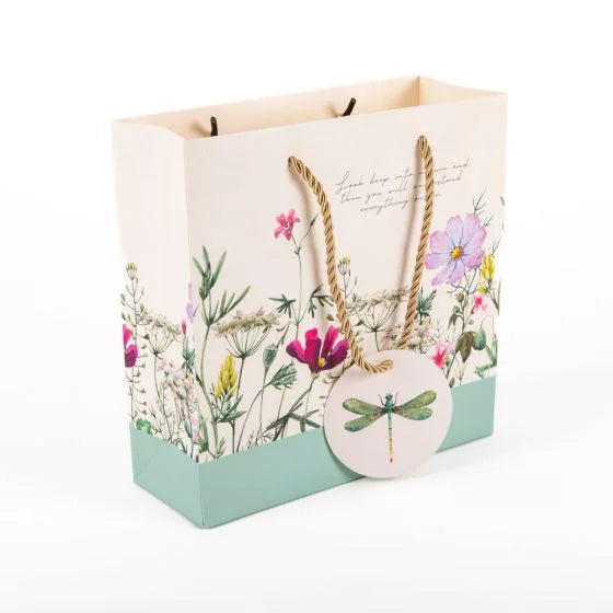a paper bag with a dragonfly on it