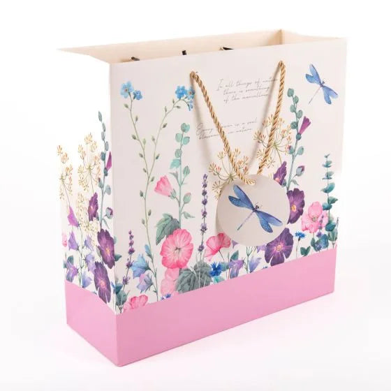 a paper bag with a necklace on it