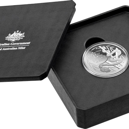 a black box with a silver coin in it