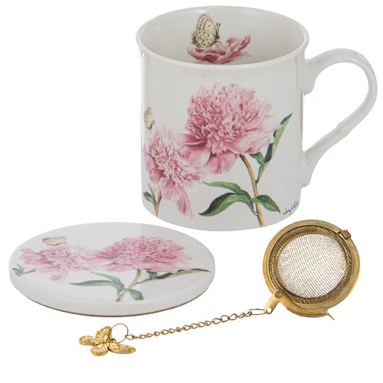 a coffee cup with a tea strainer next to it