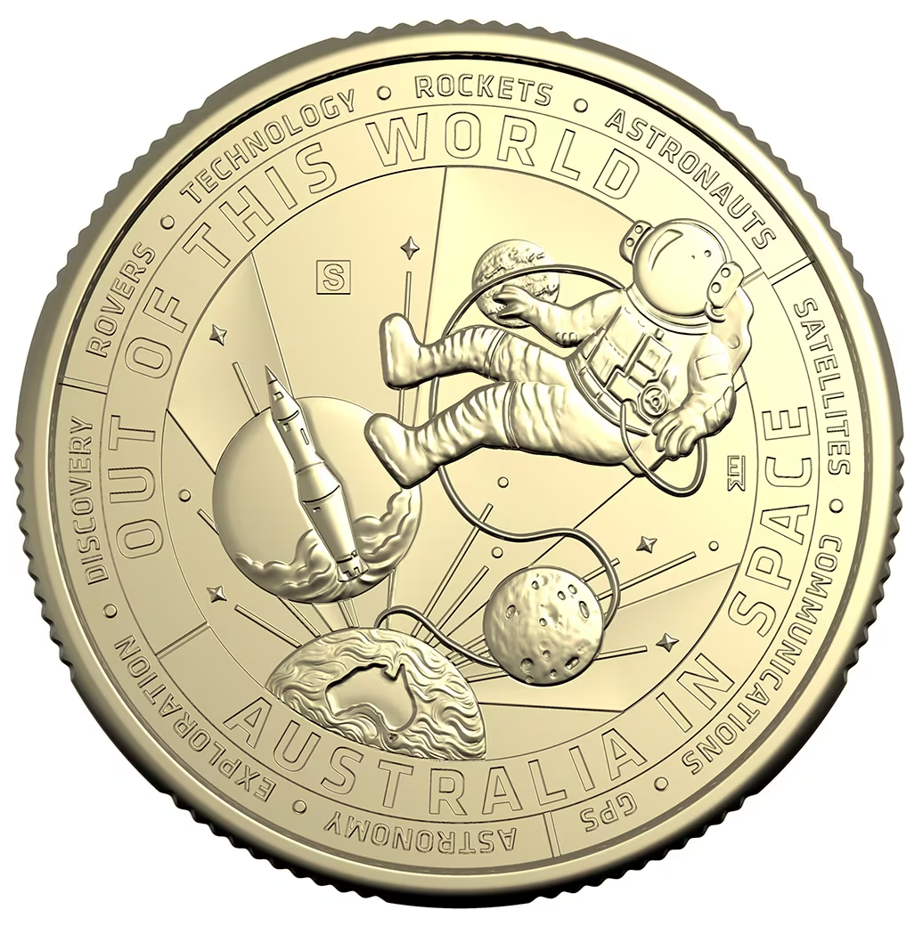 a gold coin with a picture of an astronaut floating in space