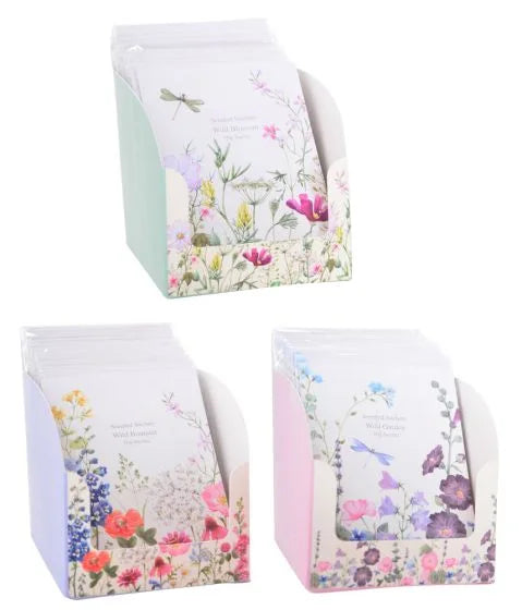 a set of three bags with flowers on them