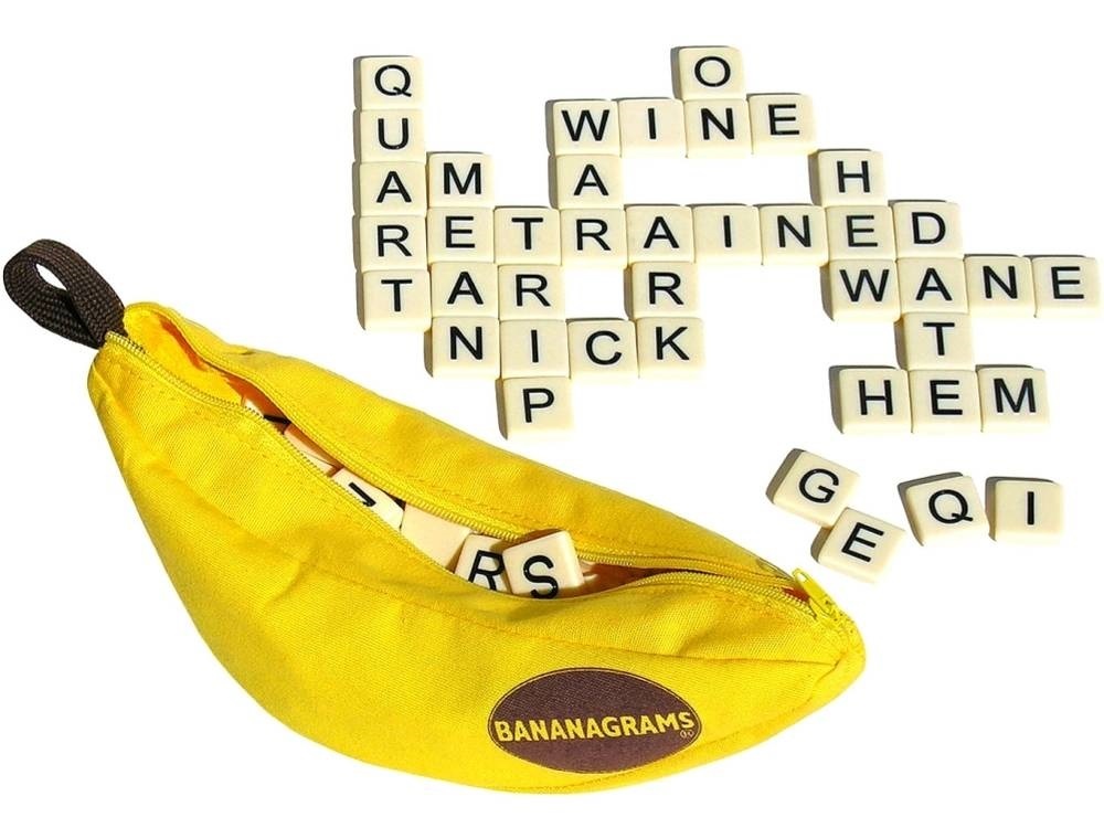 a banana sitting next to a scrabble of words