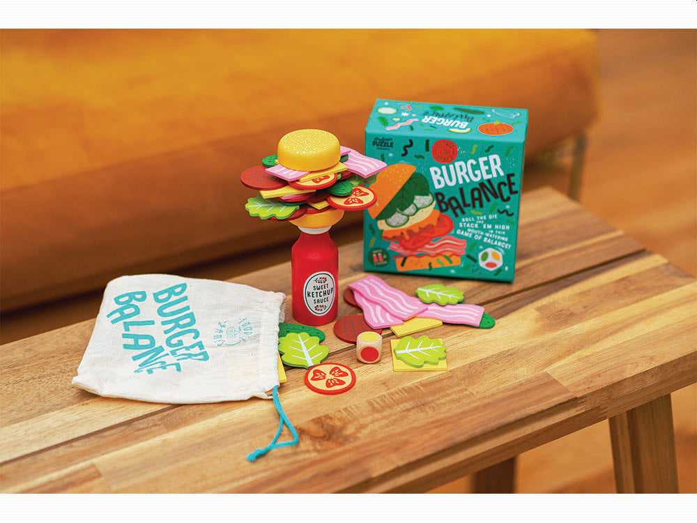 a wooden table topped with a bag of burger palace