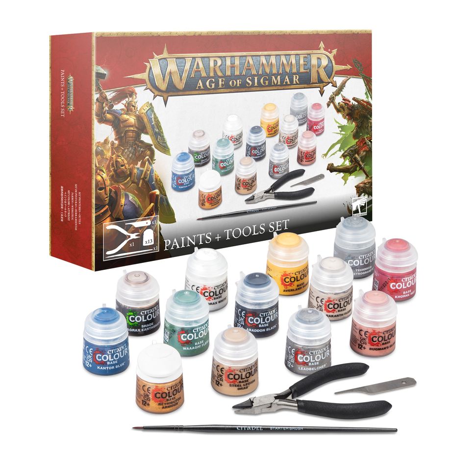 a box of paint and a pair of scissors