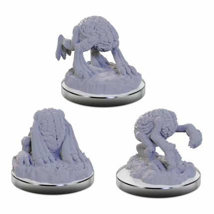 a set of three small figurines of a person with a brain