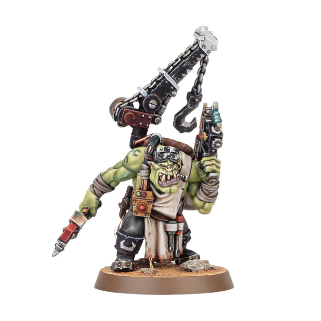Ork Mek miniature, painted, studio view