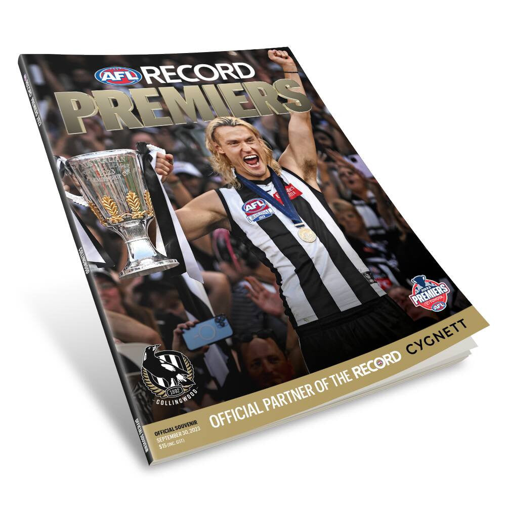a book with a picture of a man holding a trophy