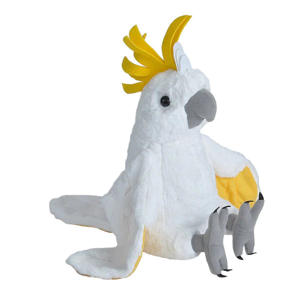 a white stuffed bird with a yellow beak