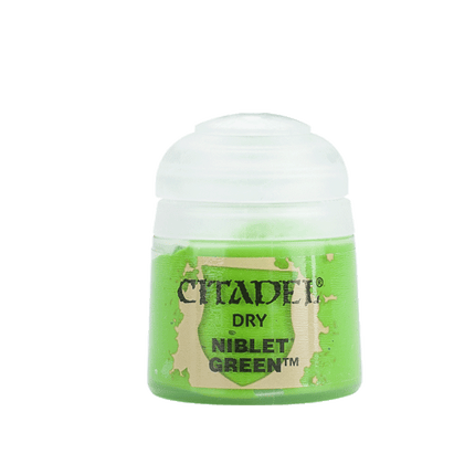 a bottle of green paint on a white background