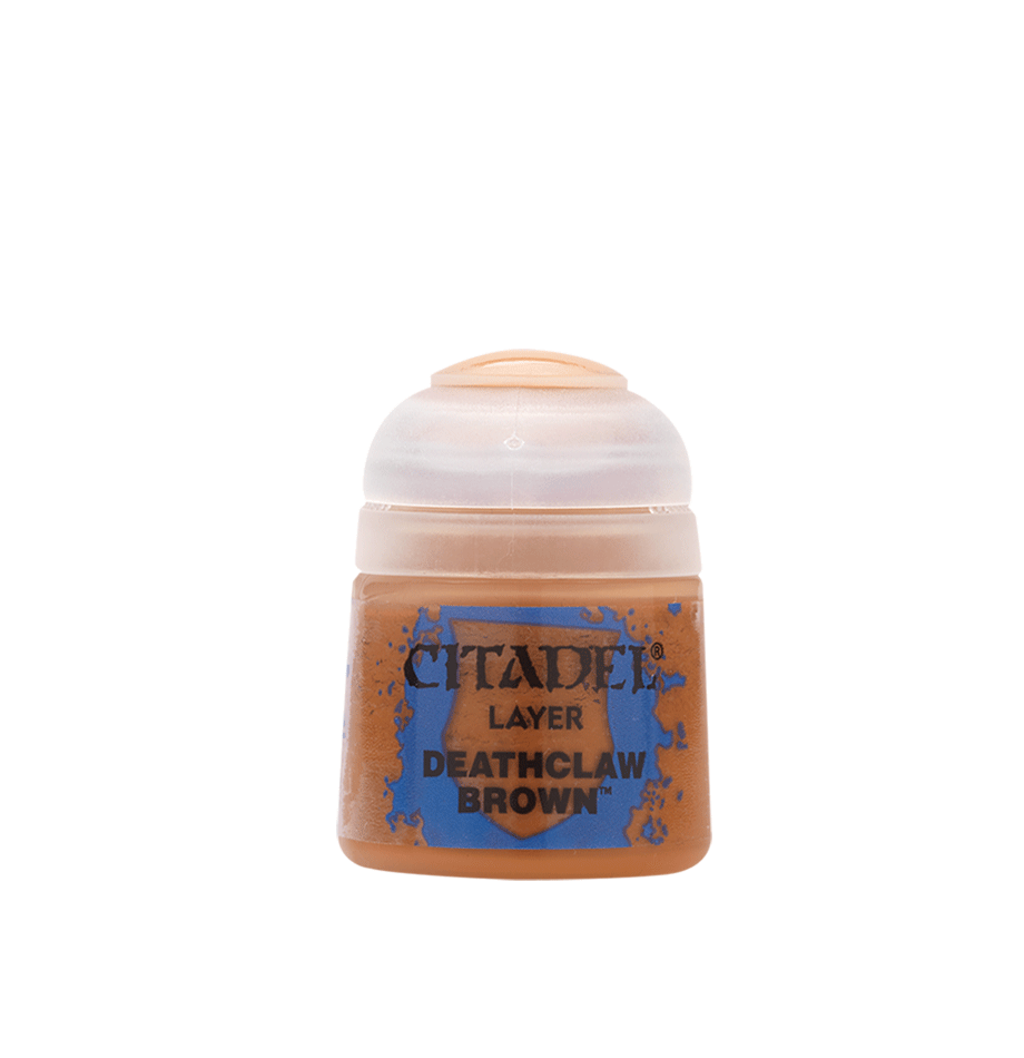 a bottle of brown colored paint on a white background