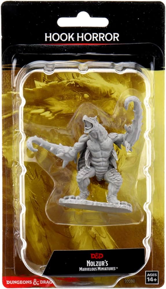 a toy figure of a creature in a plastic package