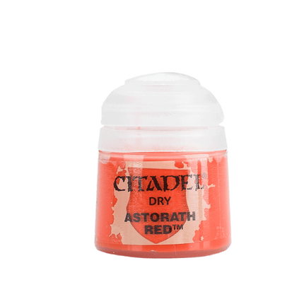 a bottle of red paint on a white background