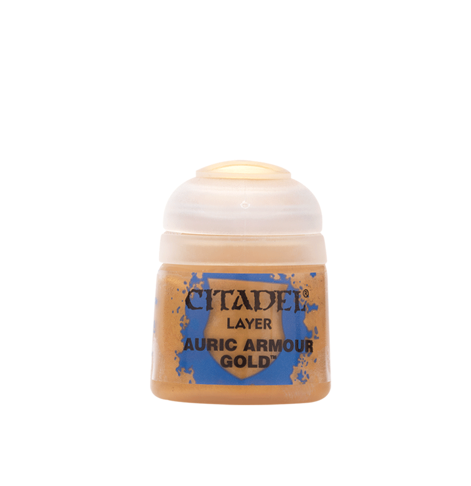 a bottle of gold acrylic paint on a white background
