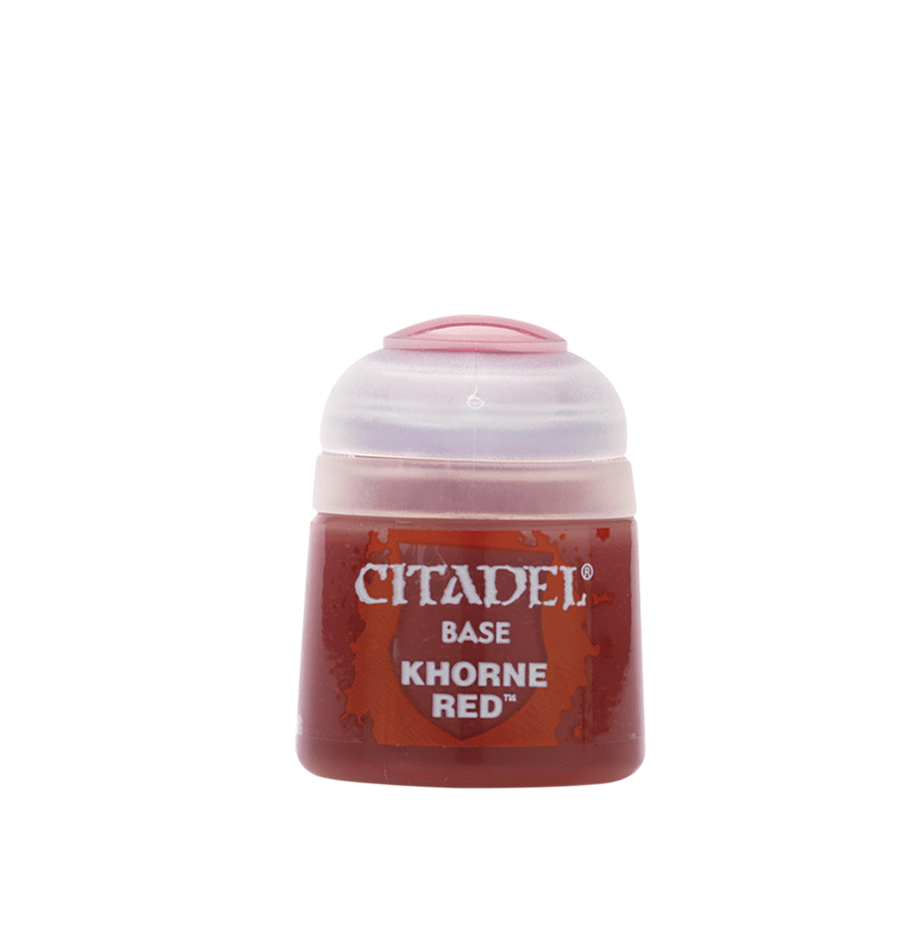 a bottle of red liquid on a white background