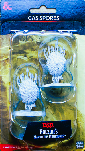 a set of three plastic toys in a package