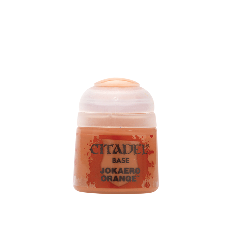 a bottle of orange paint on a white background