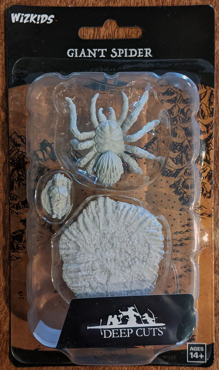a plastic toy of a giant spider