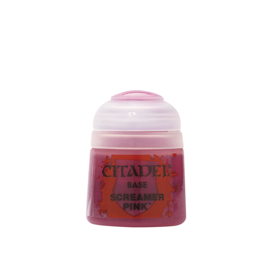 a bottle of pink paste on a white background